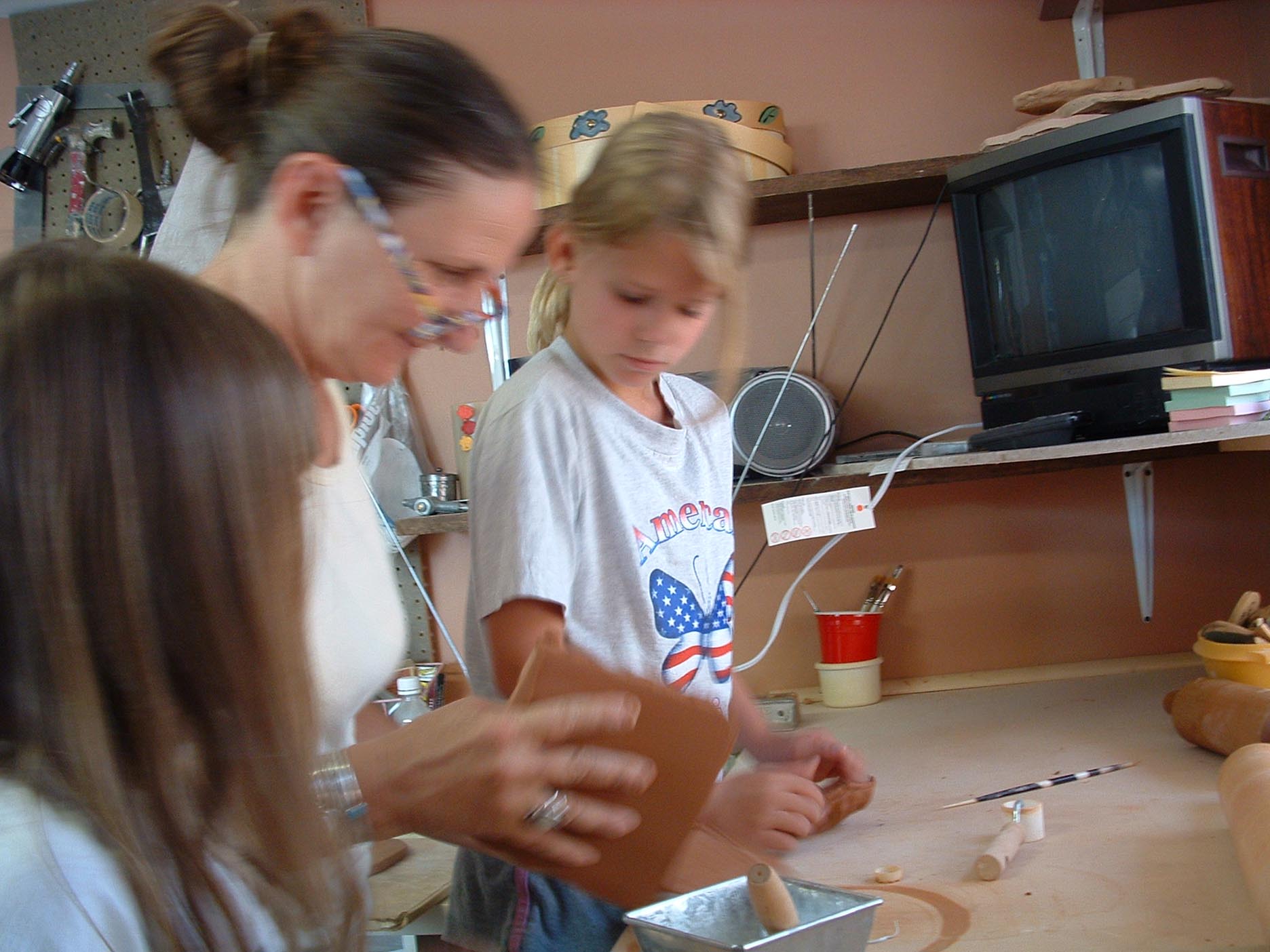 Kasha working with friends in her studio